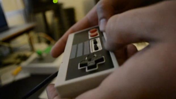 Musician Side Brain busts a move with an NES controller