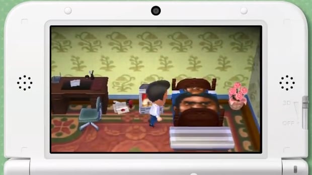 Reggie's Animal Crossing home has his face on a bed